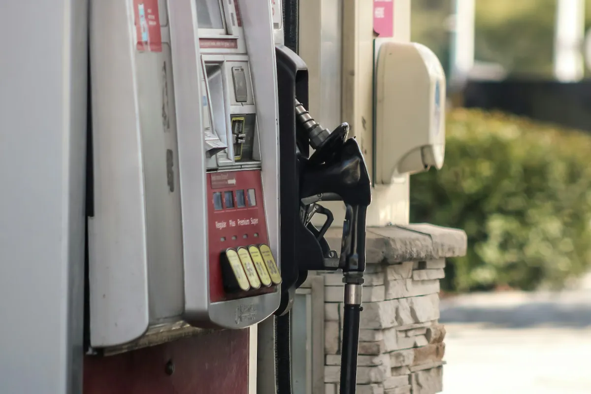 Close-up of a gas pump with its card reader, keypad and fuel nozzle