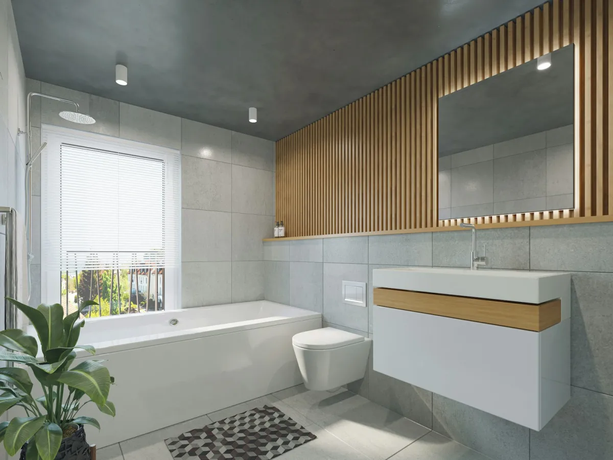A bright bathroom with a toilet, sink and bathtub
