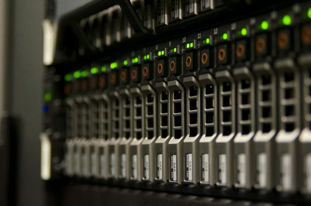 A server rack with drive bays and green status lights A server rack with drive bays and green status lights