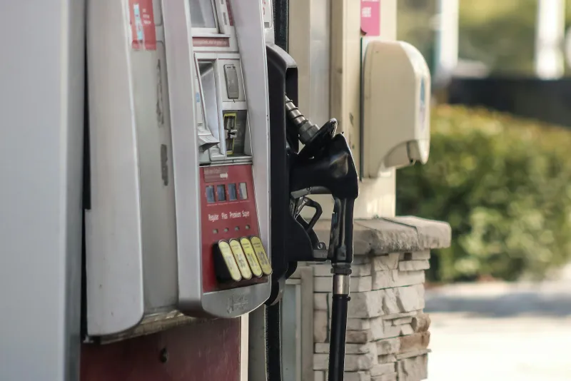 Close-up of a gas pump with its card reader, keypad and fuel nozzle